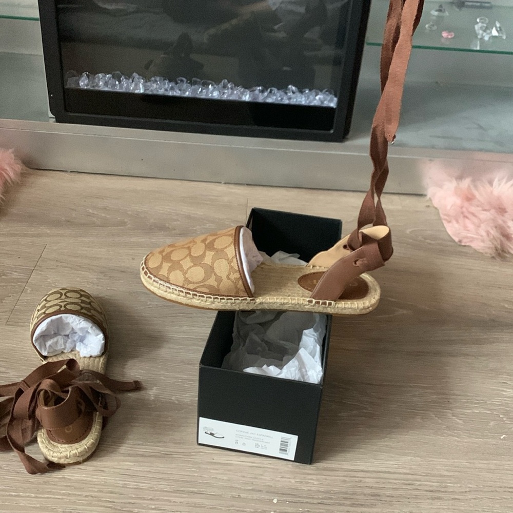 Brand New Coach Shoes received them as a gift they are to narrow never worn .